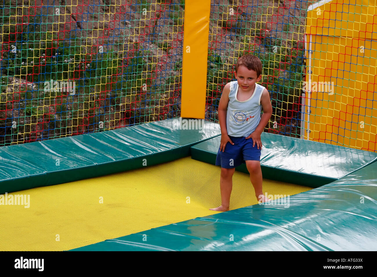 A 6year old boy jumping on a trampoline Stock Photo Alamy