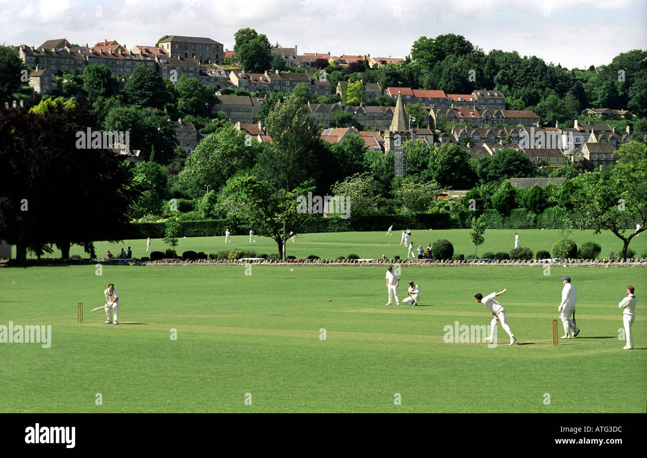 Traditional cricket match in progress with town of Bradford on Avon as backdrop Stock Photo