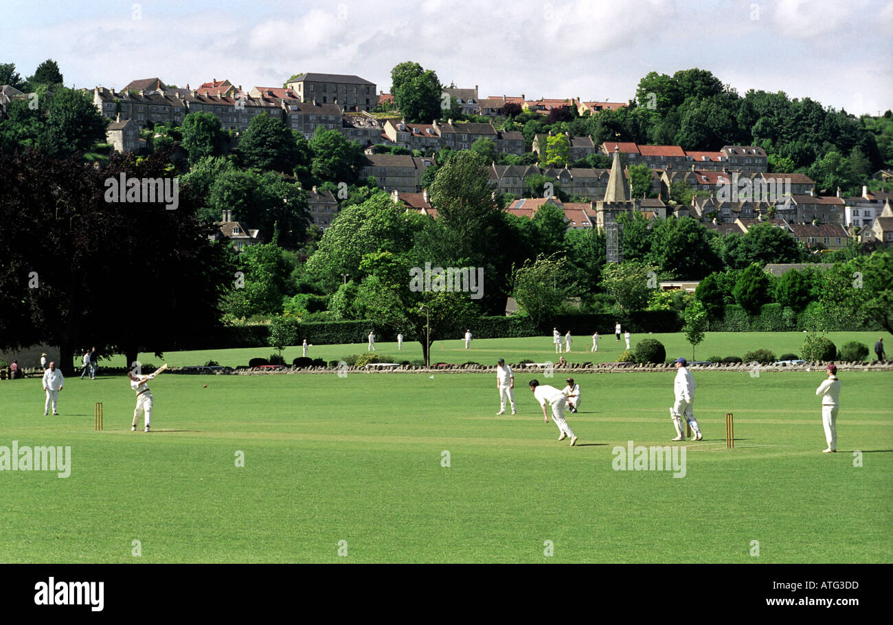 Traditional cricket match in progress with town of Bradford on Avon as backdrop Stock Photo