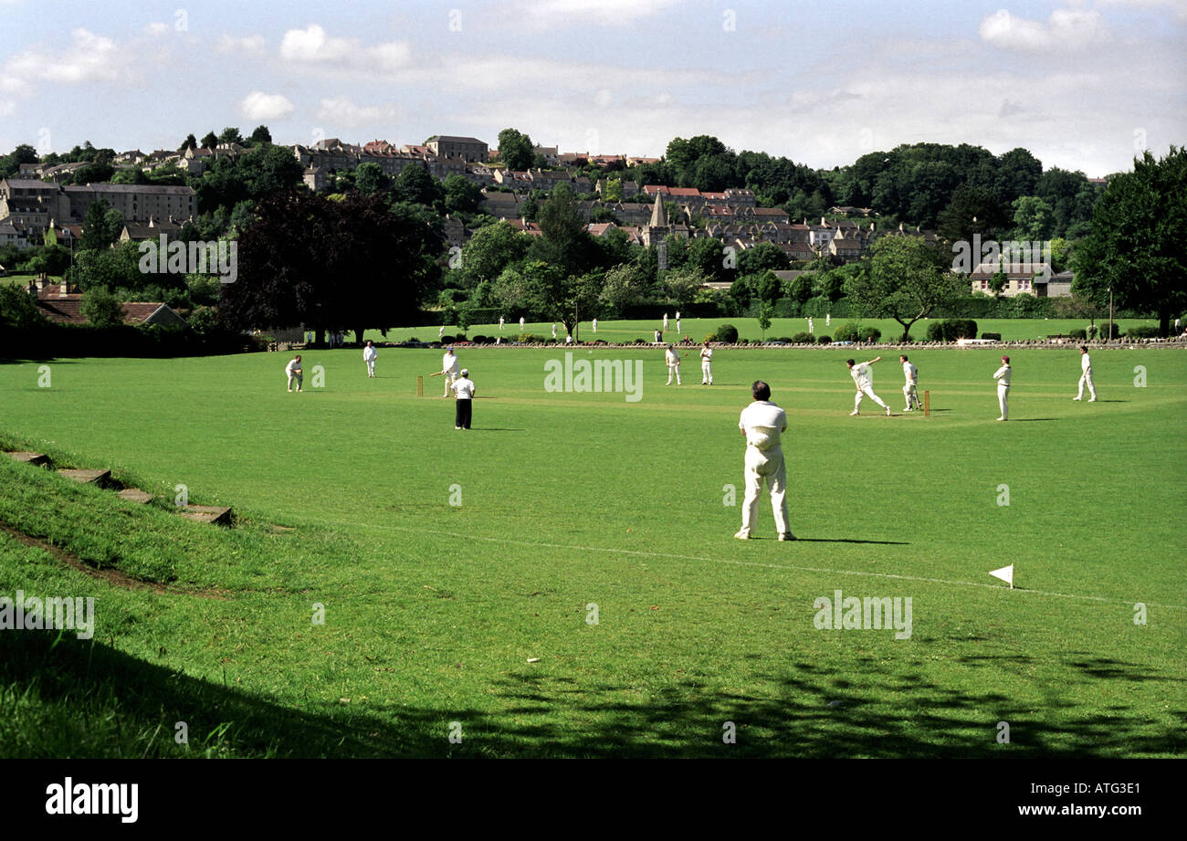 Traditional cricket match in progress with town of Bradford on Avon as backdrop Stock Photo