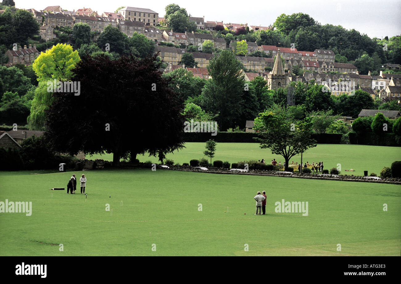 Traditional croquet match in progress with town of Bradford on Avon as backdrop Stock Photo