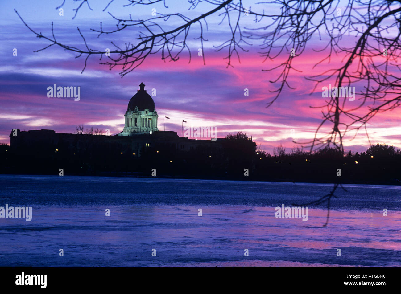 Legislative building at dusk across Wascana lake in Regina Stock Photo
