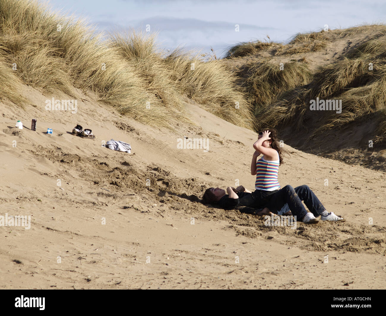 Young couple having fun at the beach Stock Photo