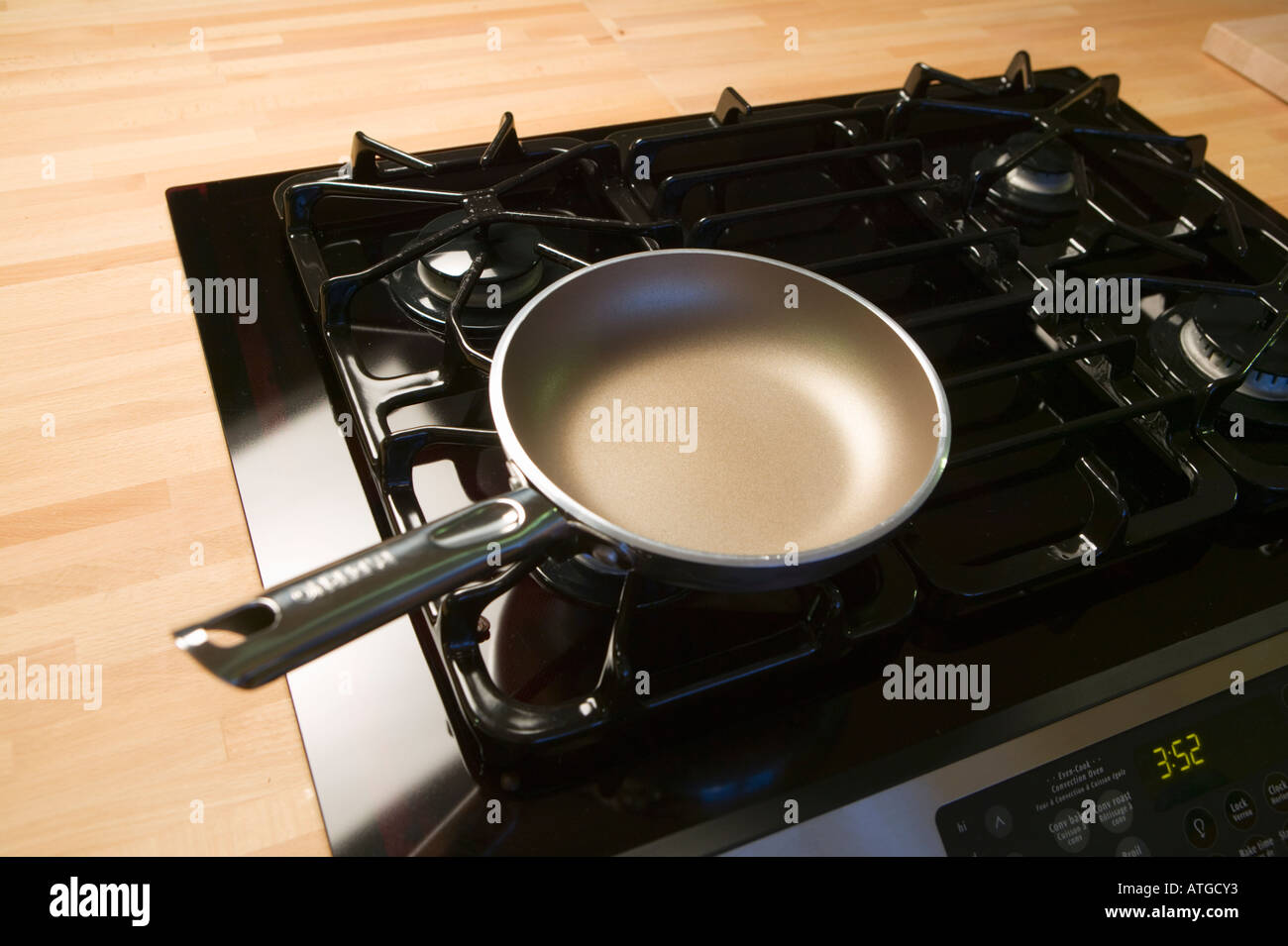 Frying Pan on a Gas Stove Stock Photo Alamy