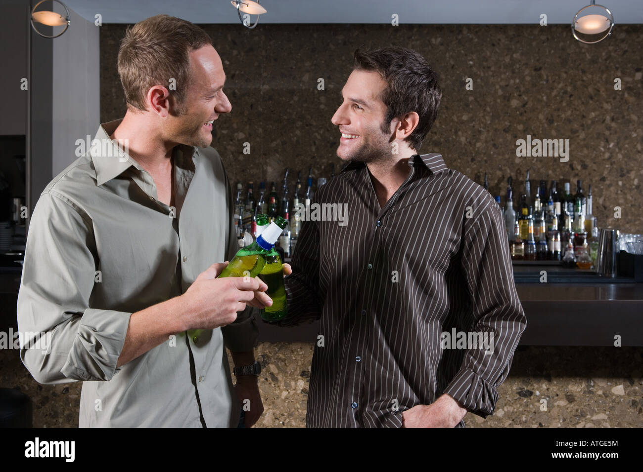 Two men drinking in a bar Stock Photo