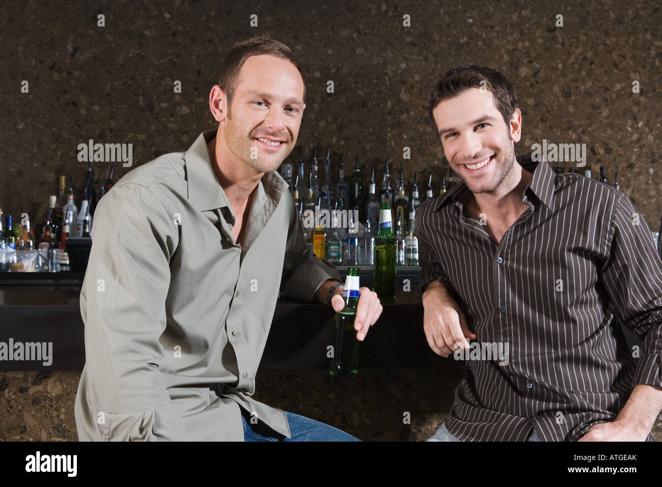 Two men drinking in a bar Stock Photo