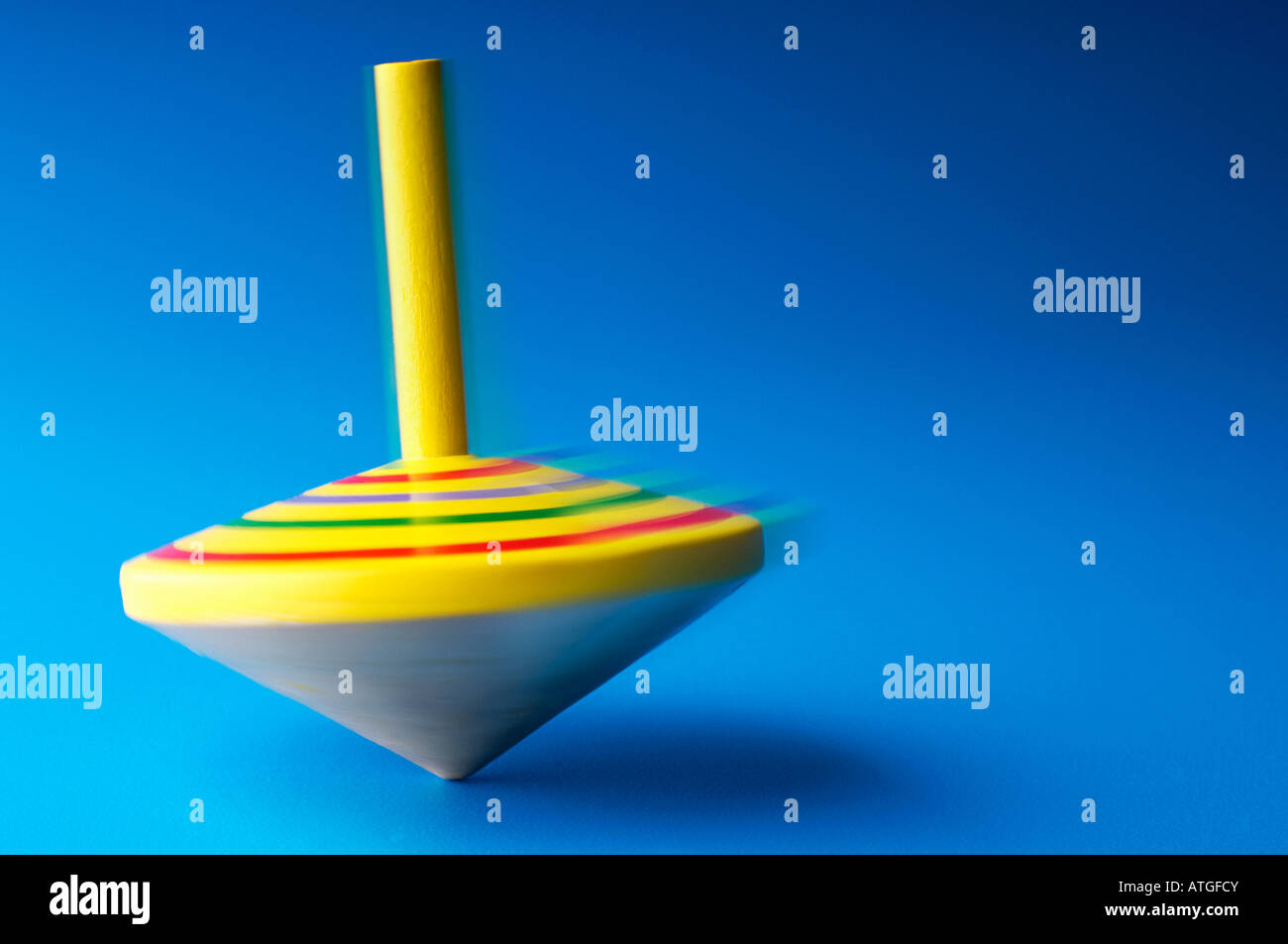 Yellow spinning top hires stock photography and images Alamy
