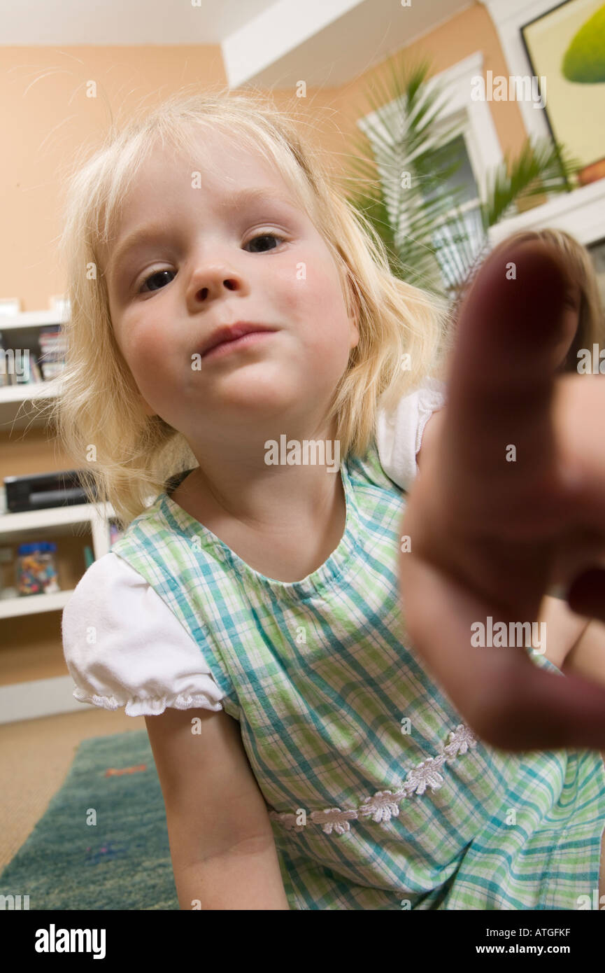 Young Girl Pointing Her Finger Stock Photo