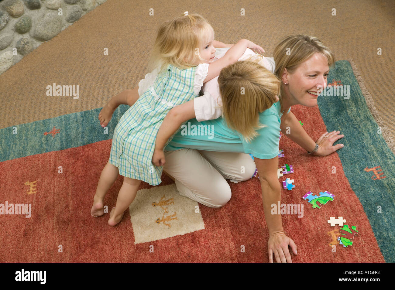 Mom and Daughters With a Jigsaw Puzzle Stock Photo Alamy