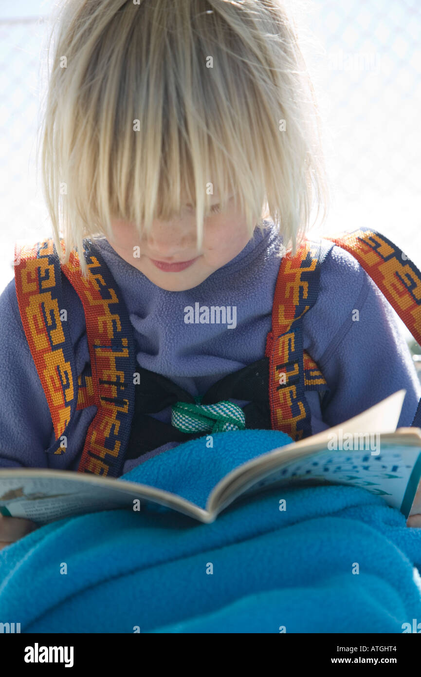 Young Girl Reading on a Boat Stock Photo