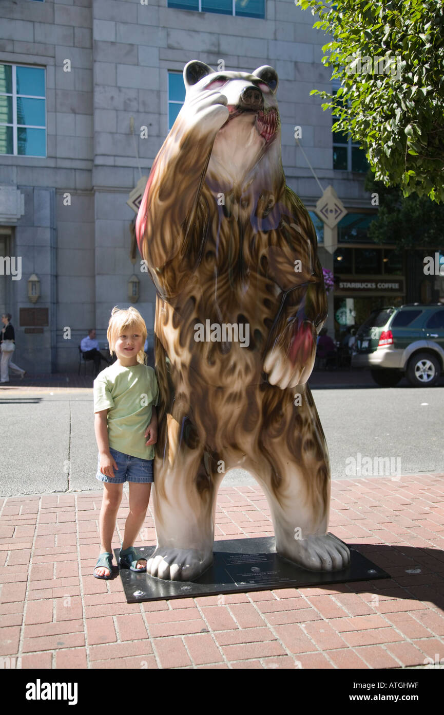 Young Girl and Bear Statue Victoria British Columbia Stock Photo