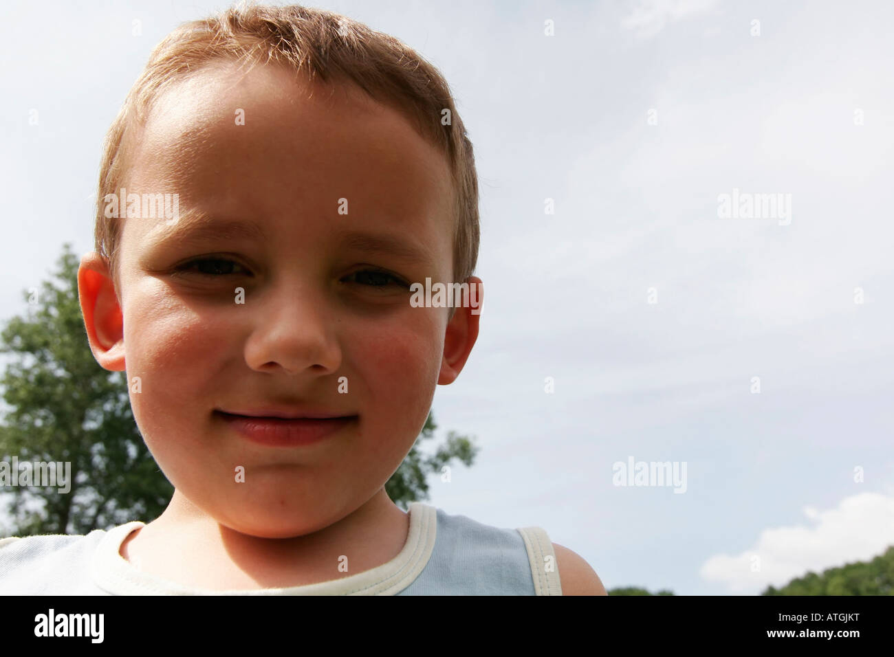 youn boy portrait with blue sky Stock Photo - Alamy