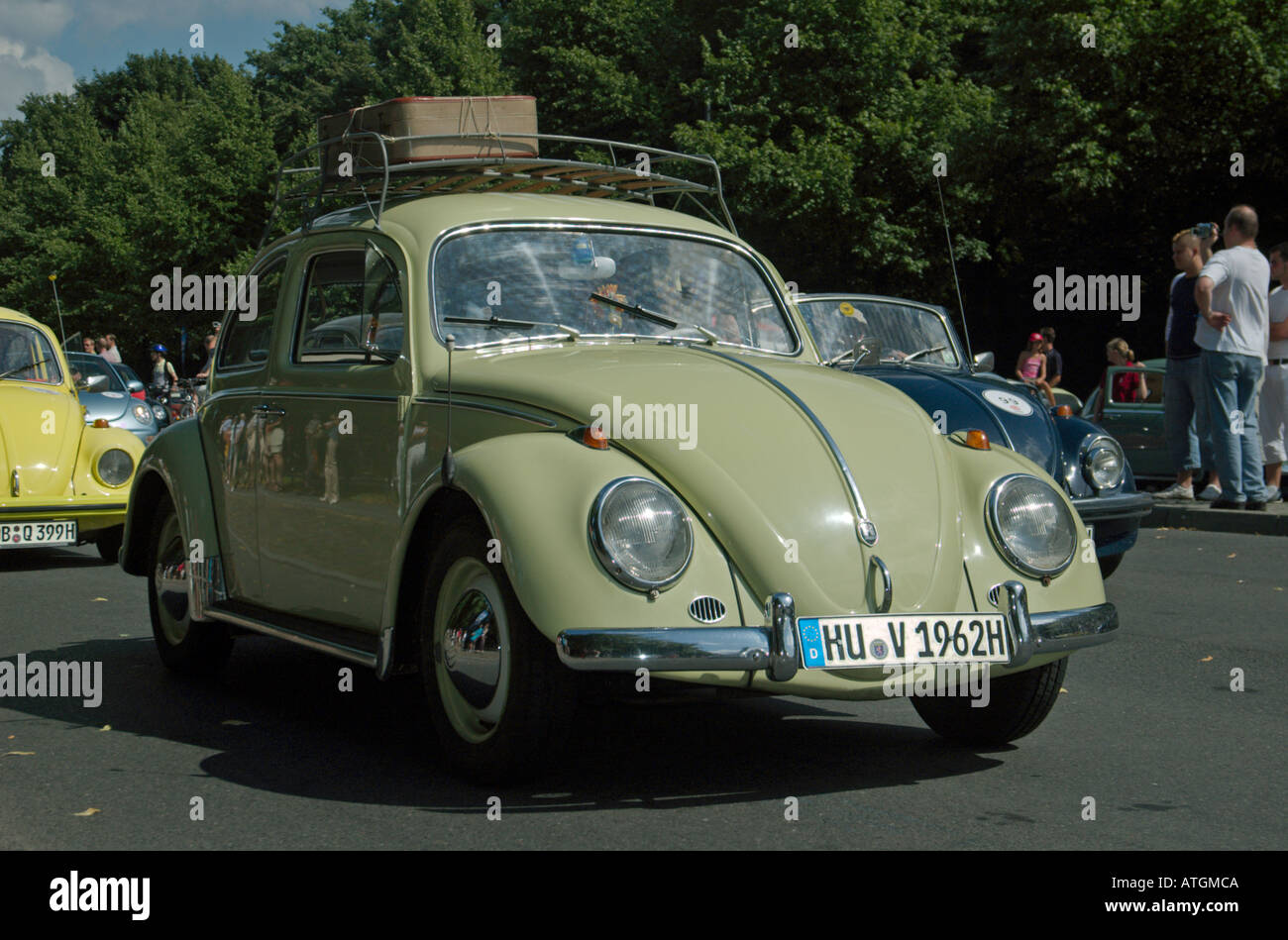 A pale green historic Beetle with roofrack and luggage on europes biggest gathering of VW Beetle cars in Berlin 2005-07-30. Stock Photo