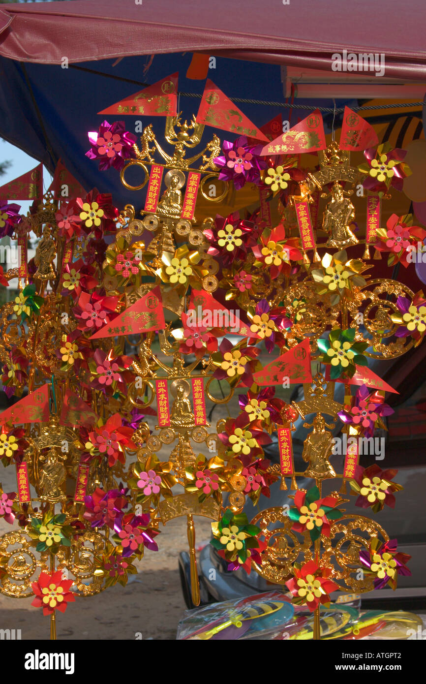 ‘Chuin Wan Fung Cheh’ miniature fans made from colourful metallic paper used by Chinese for prayers Stock Photo