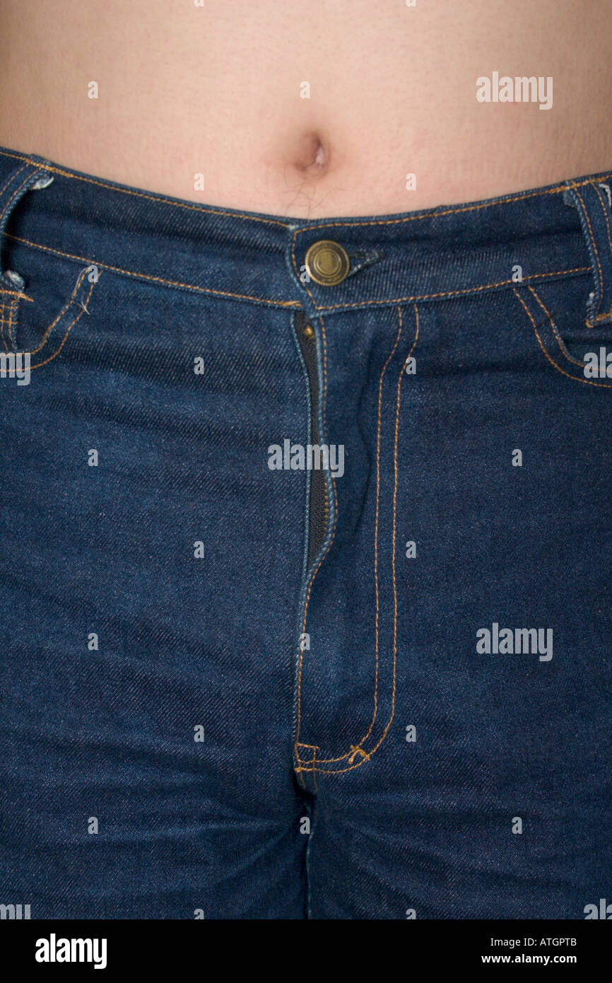 close up of man in blue jeans with belly button exposed Stock Photo - Alamy