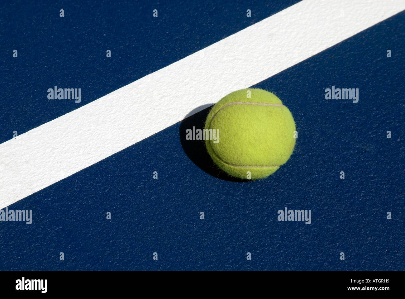 Tennis ball on boundary line Stock Photo Alamy