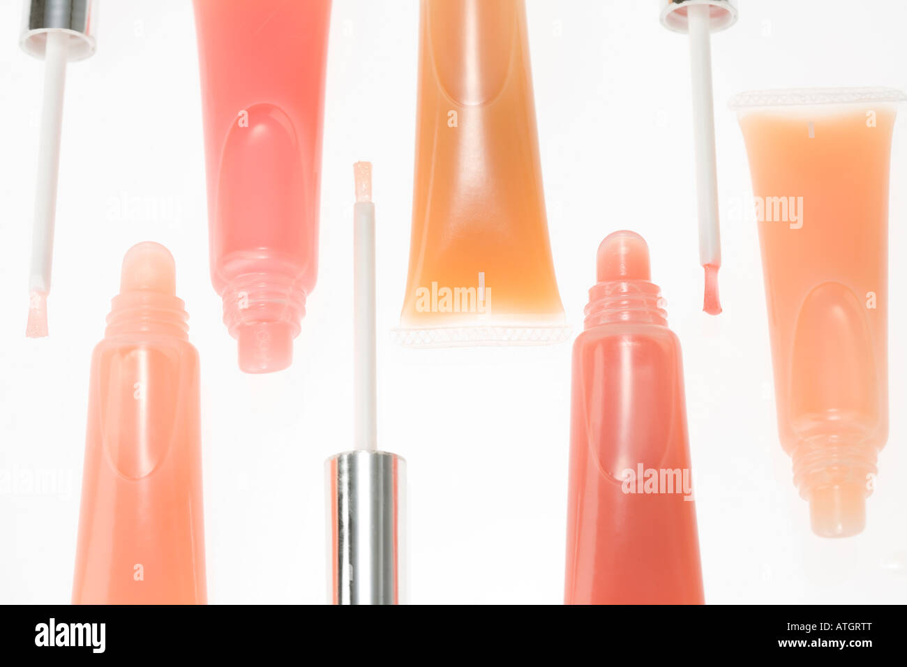 Lip gloss tubes and applicators Stock Photo