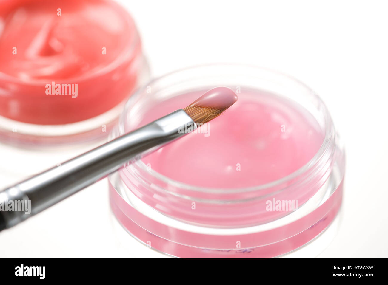 Lip gloss and lip brush Stock Photo