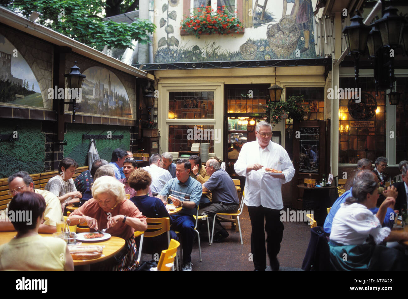 People At The Terrace Of The Cider Restaurant Pub Zum Gemalten Haus Stock Photo Alamy