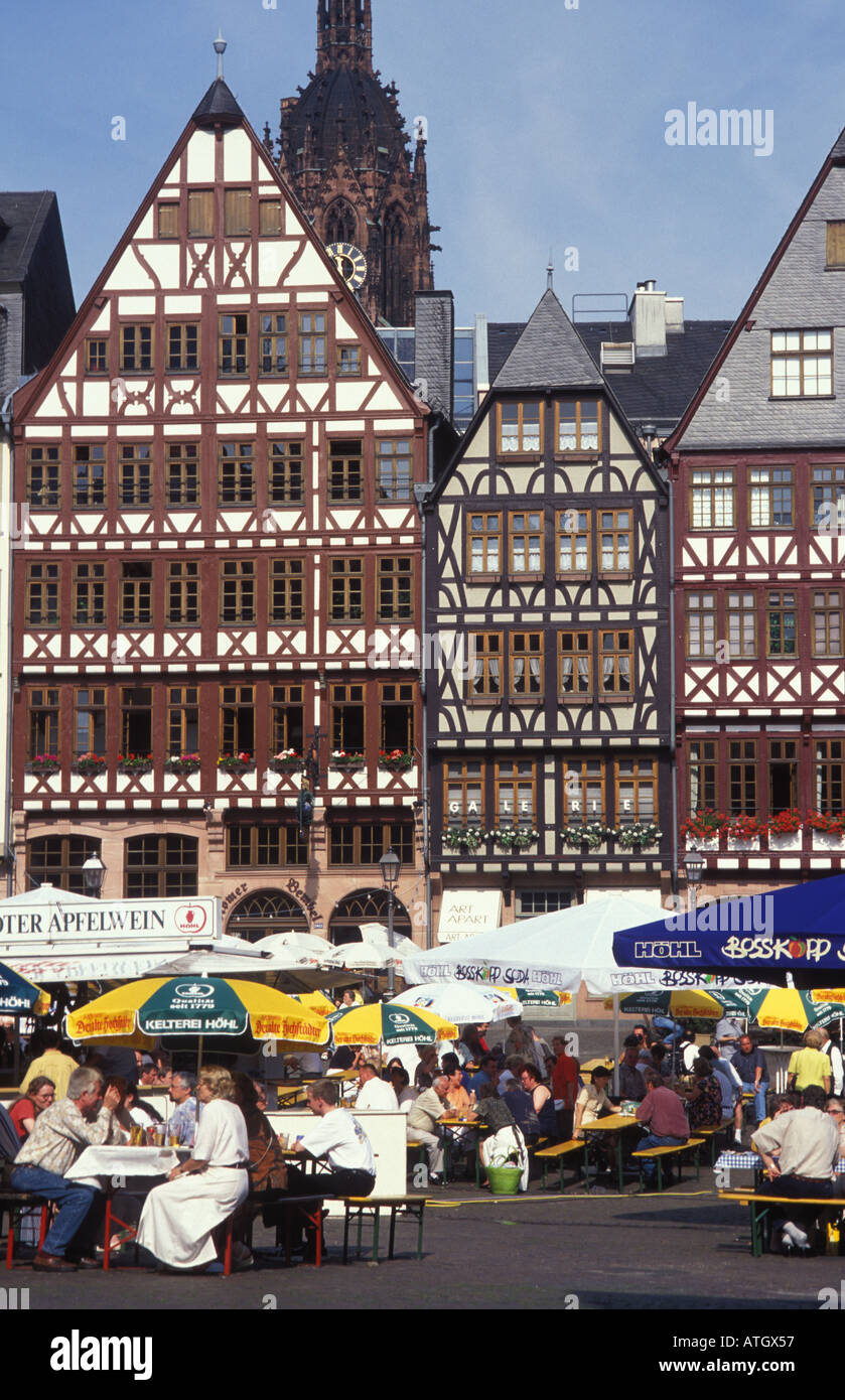 People at the festival Apfelweinfest in front of cider restaurants and pubs Roemerberg Square Frankfurt Hesse Germany Stock Photo