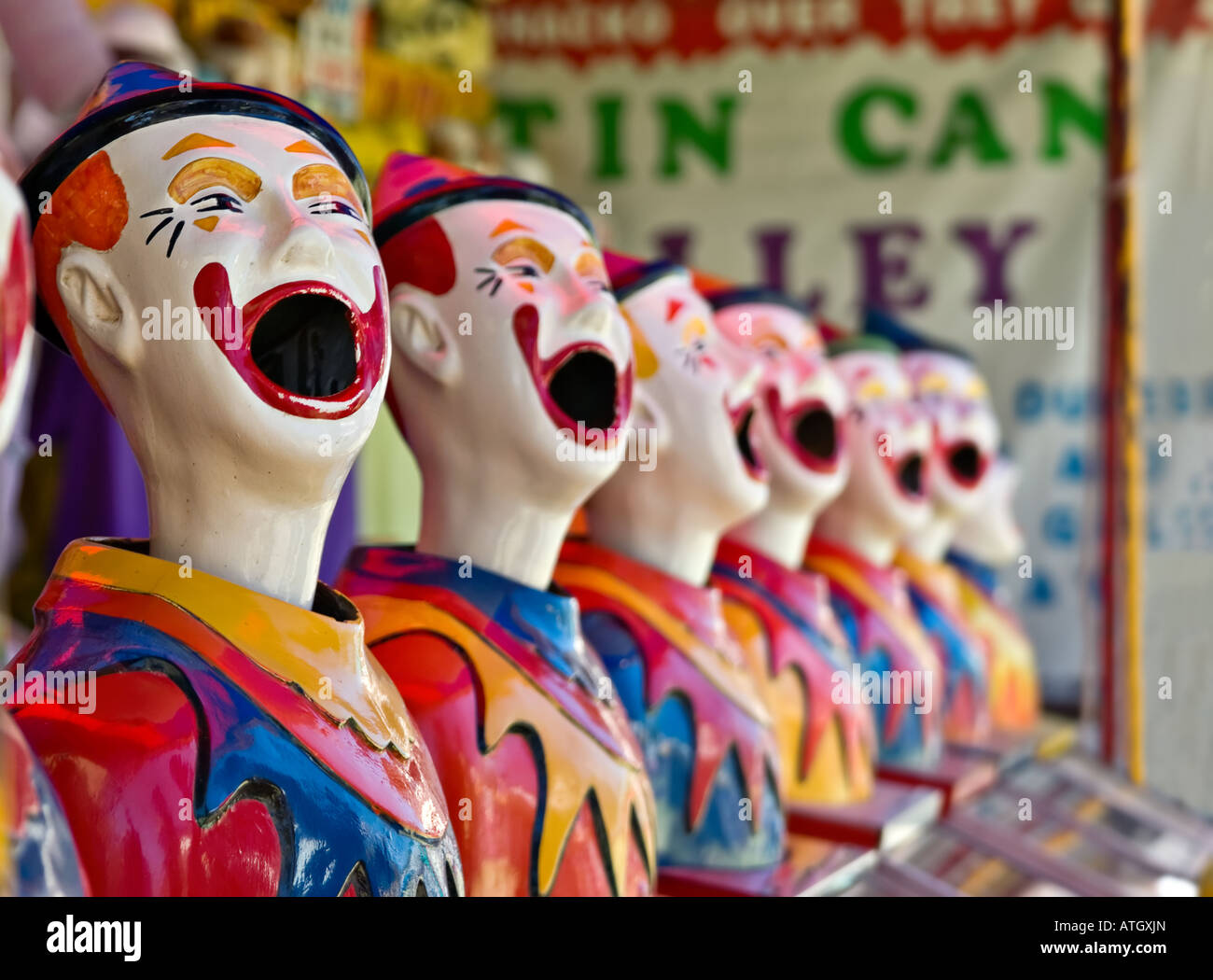 lots of clowns in a row at the fete Stock Photo