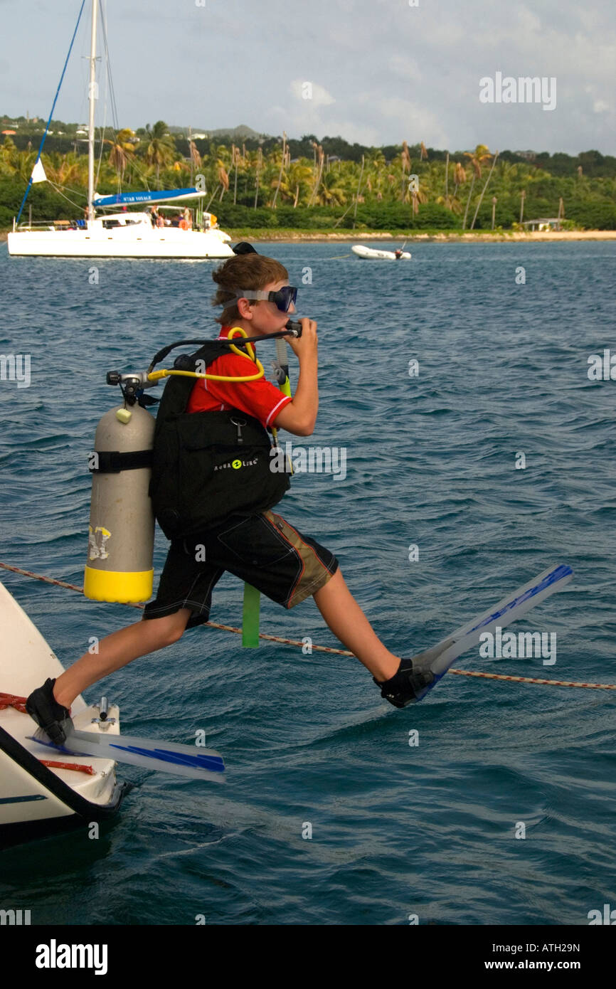 scuba diver jumping in the water, caribbean, kid, teenager, jump to the