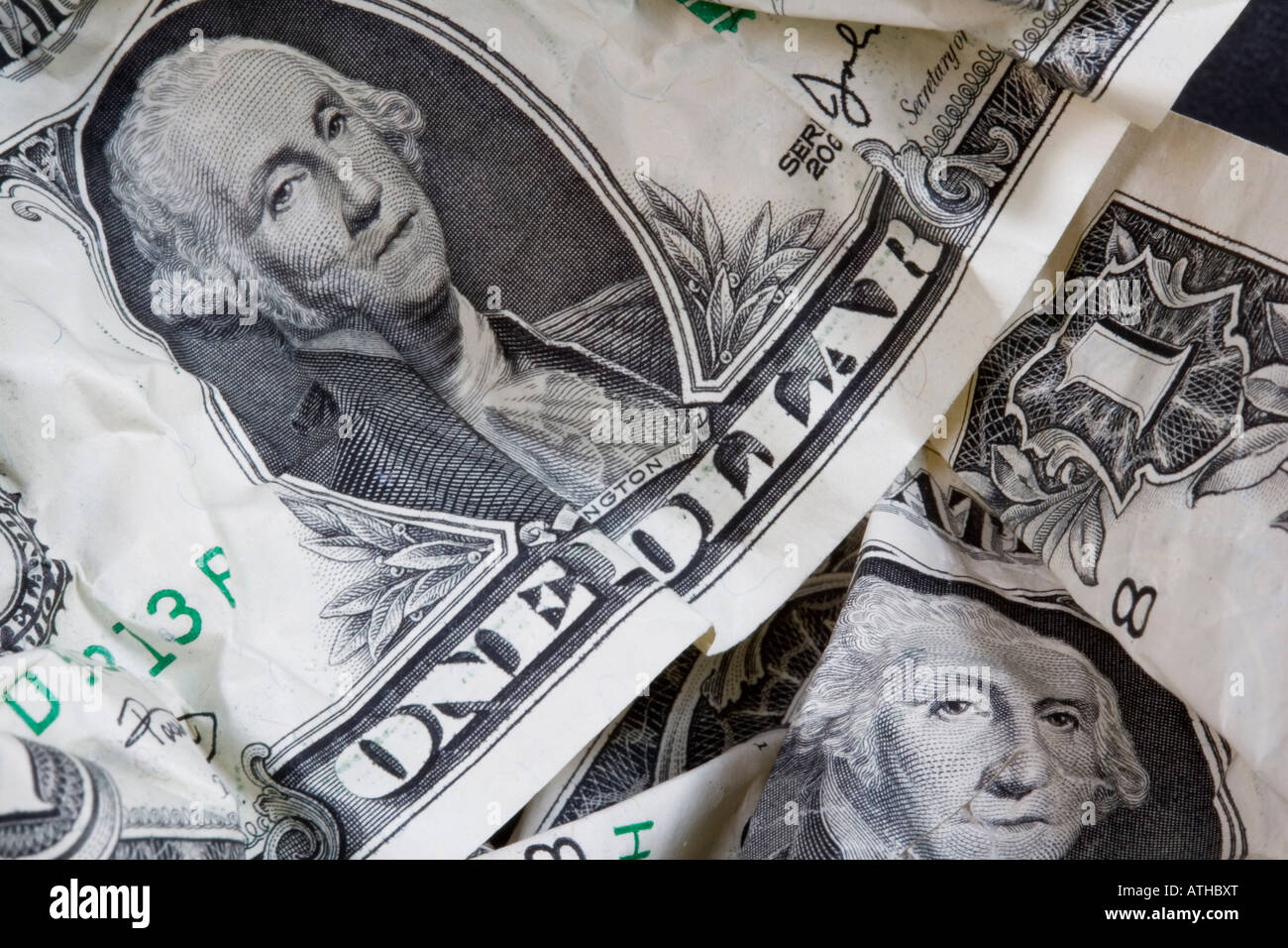 Crumpled up and damaged 1 Dollar banknotes Stock Photo