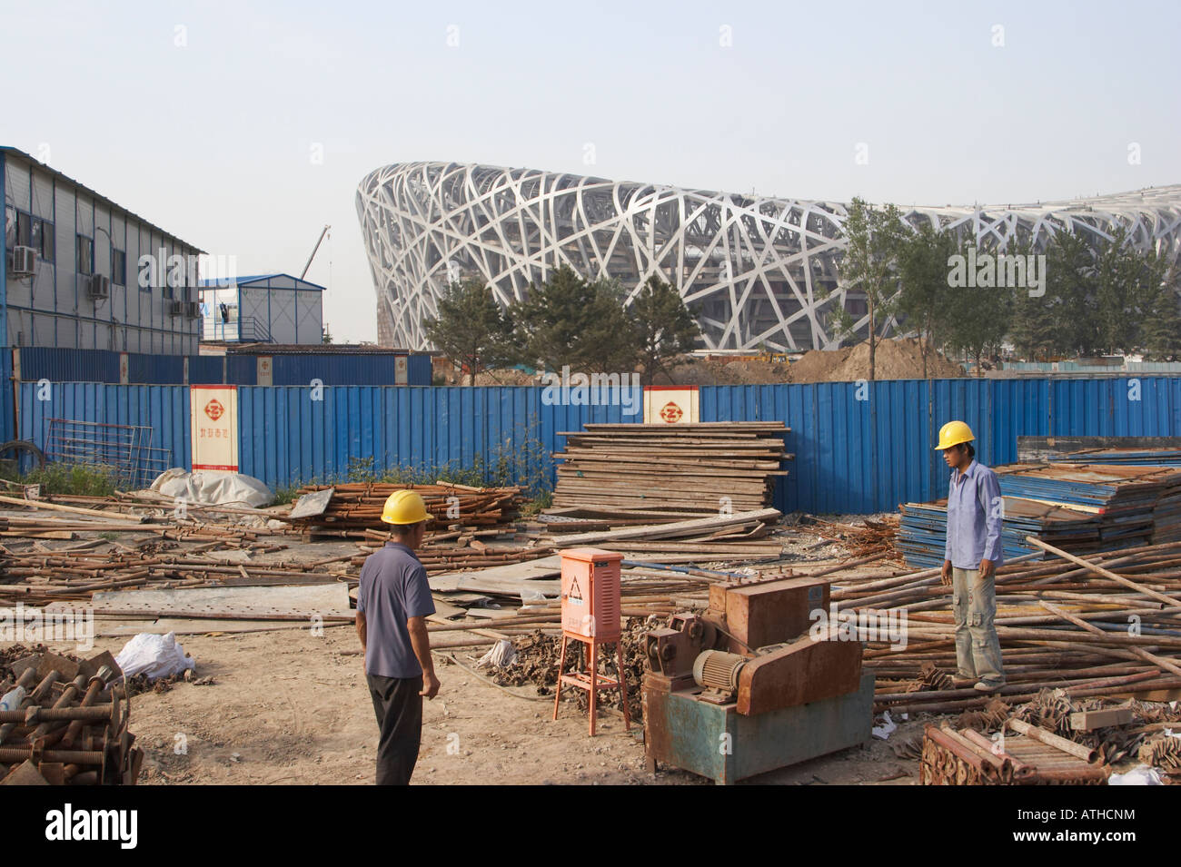Workers On Construction Site Outside Olympic Stadium, Beijing Stock Photo