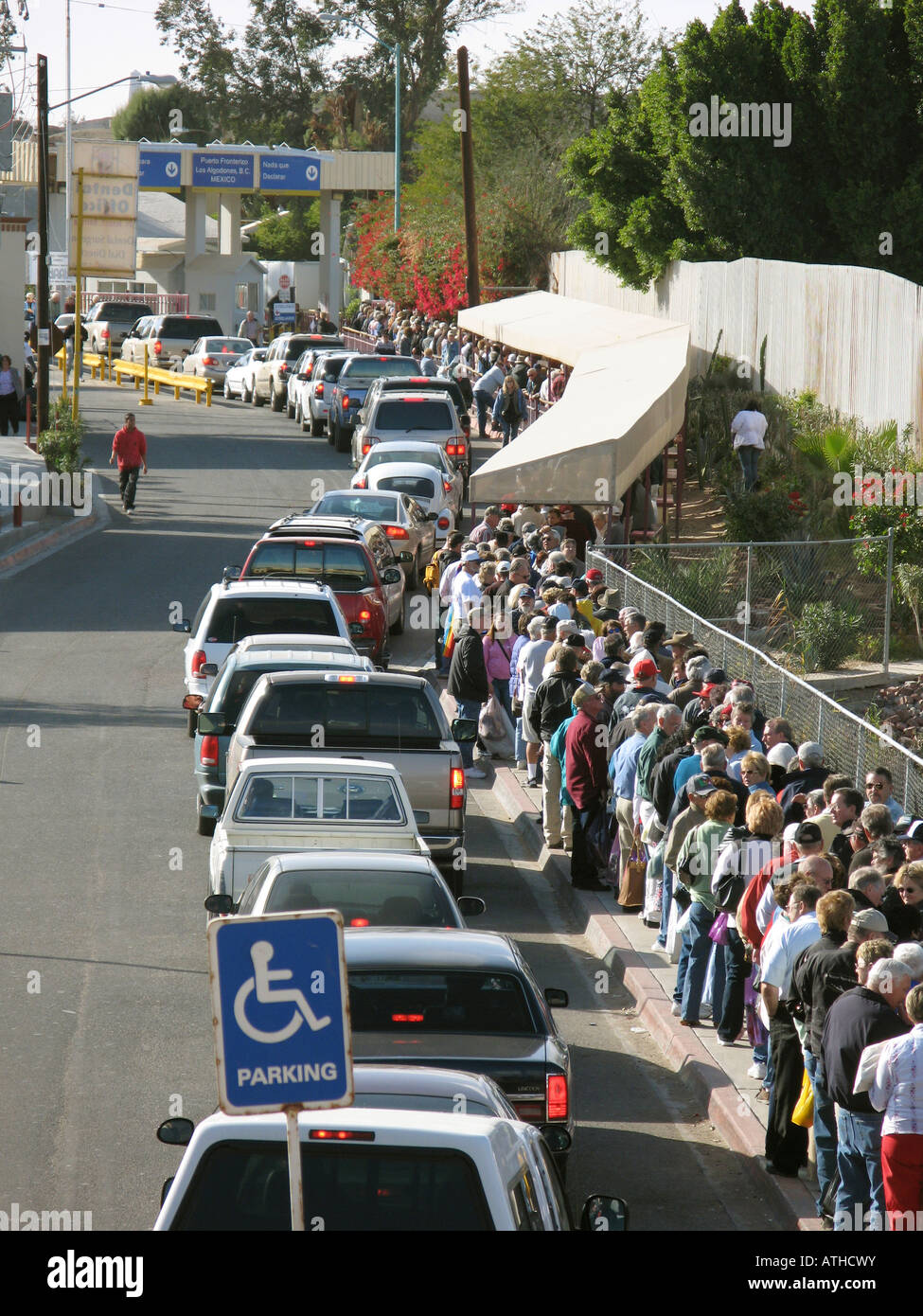 Medical tourists queuing up at Mexican United States border station, USA Stock Photo