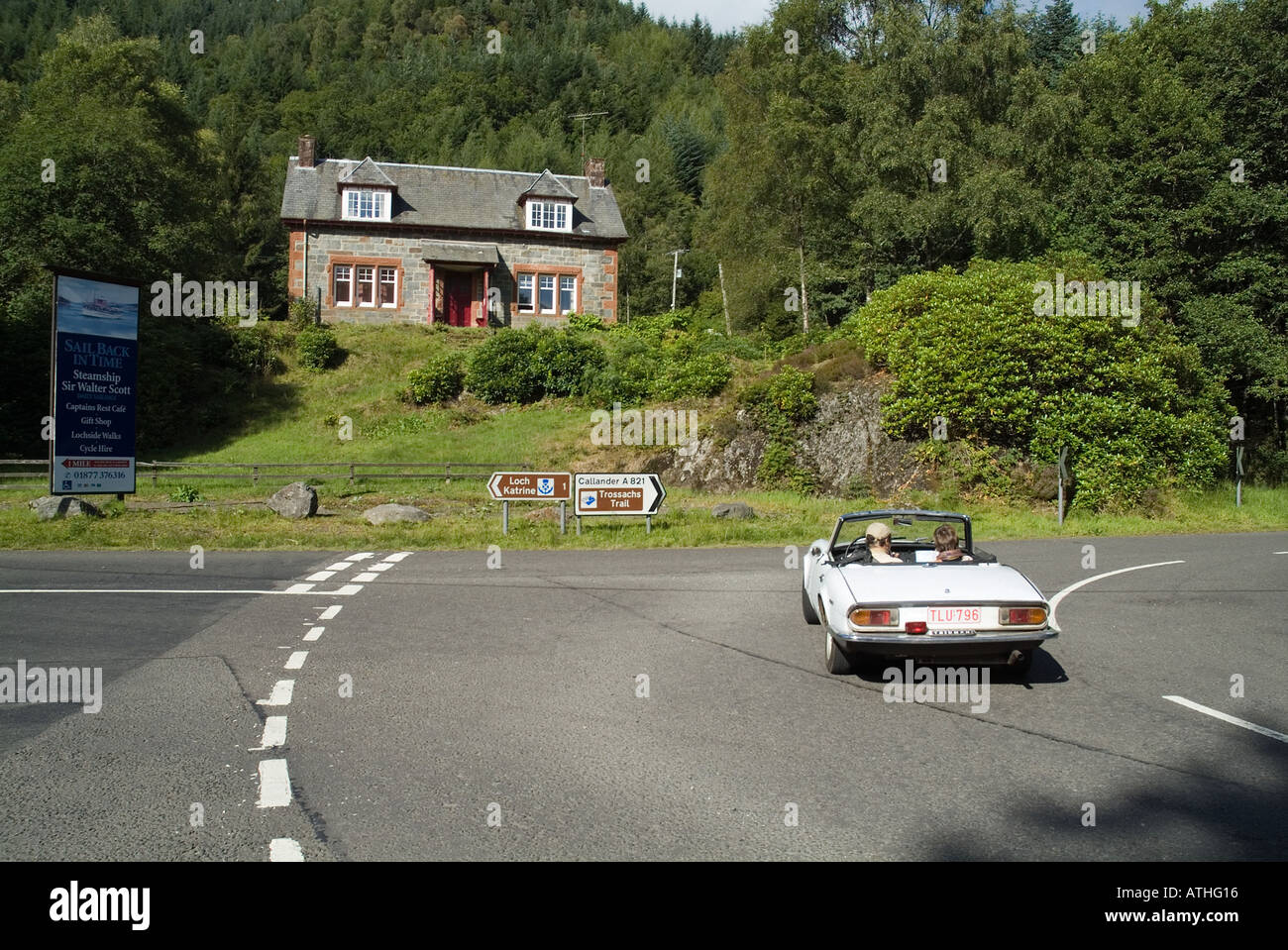 dh Trossachs scotland LOCH ACHRAY STIRLINGSHIRE Touring Triumph Stag convertible tourists classic car road trips uk driving a821 Stock Photo