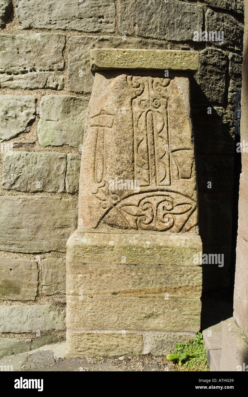 dh Pictish art carving ABERNETHY PERTHSHIRE SCOTLAND On stone at foot of 11st century Irish round tower celtic monolith stones Stock Photo