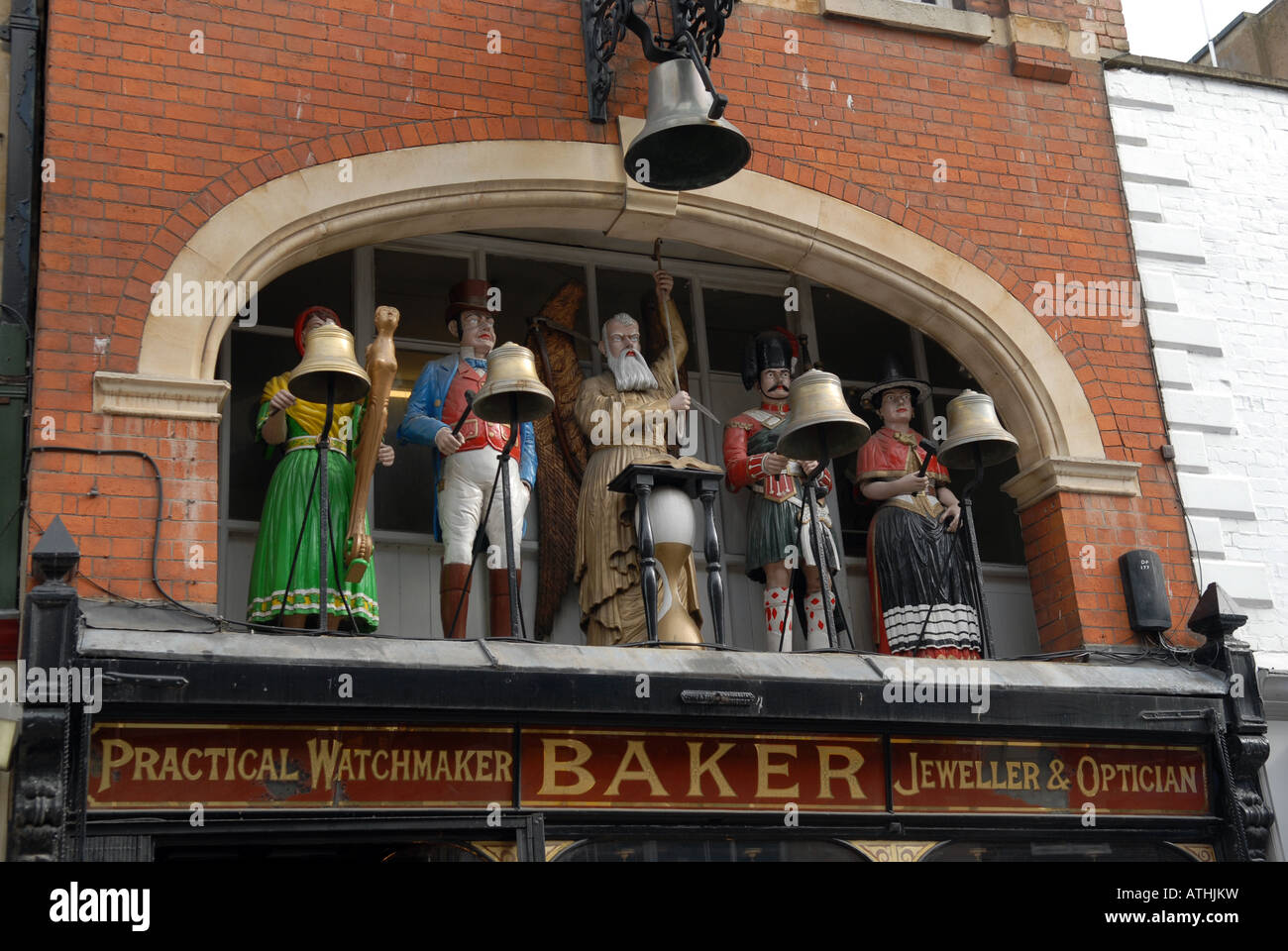 Clock and figures over Bakers jewellers in Southgate in city of Gloucester, England. Stock Photo