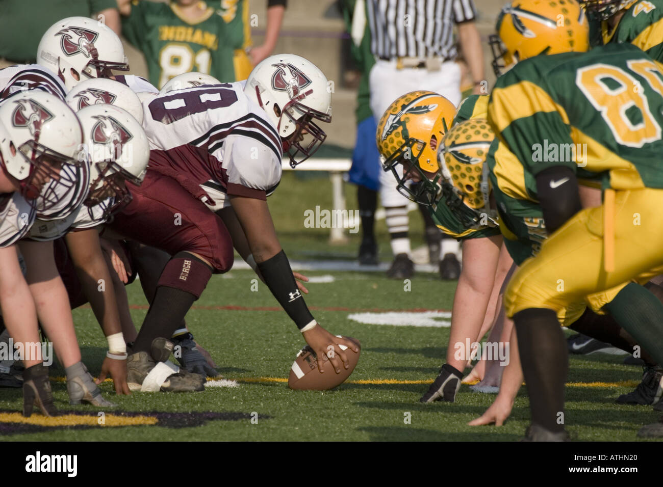 Hiking the ball line of scrimmage high school football game Stock Photo