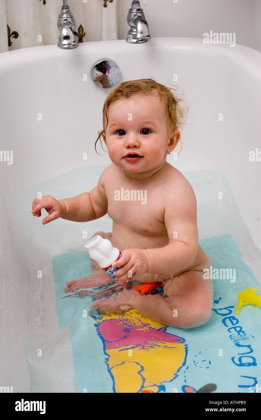 Baby Holly enjoying bath time Stock Photo Alamy