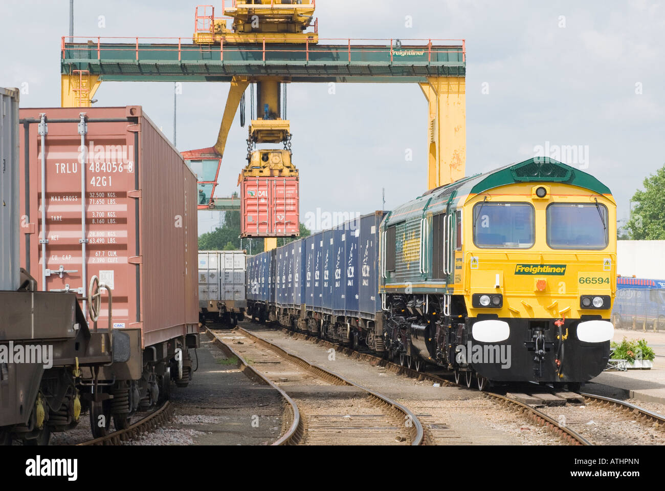 Freightliner class 66 locomotive with containers at the Southampton rail freight terminal, England. Stock Photo