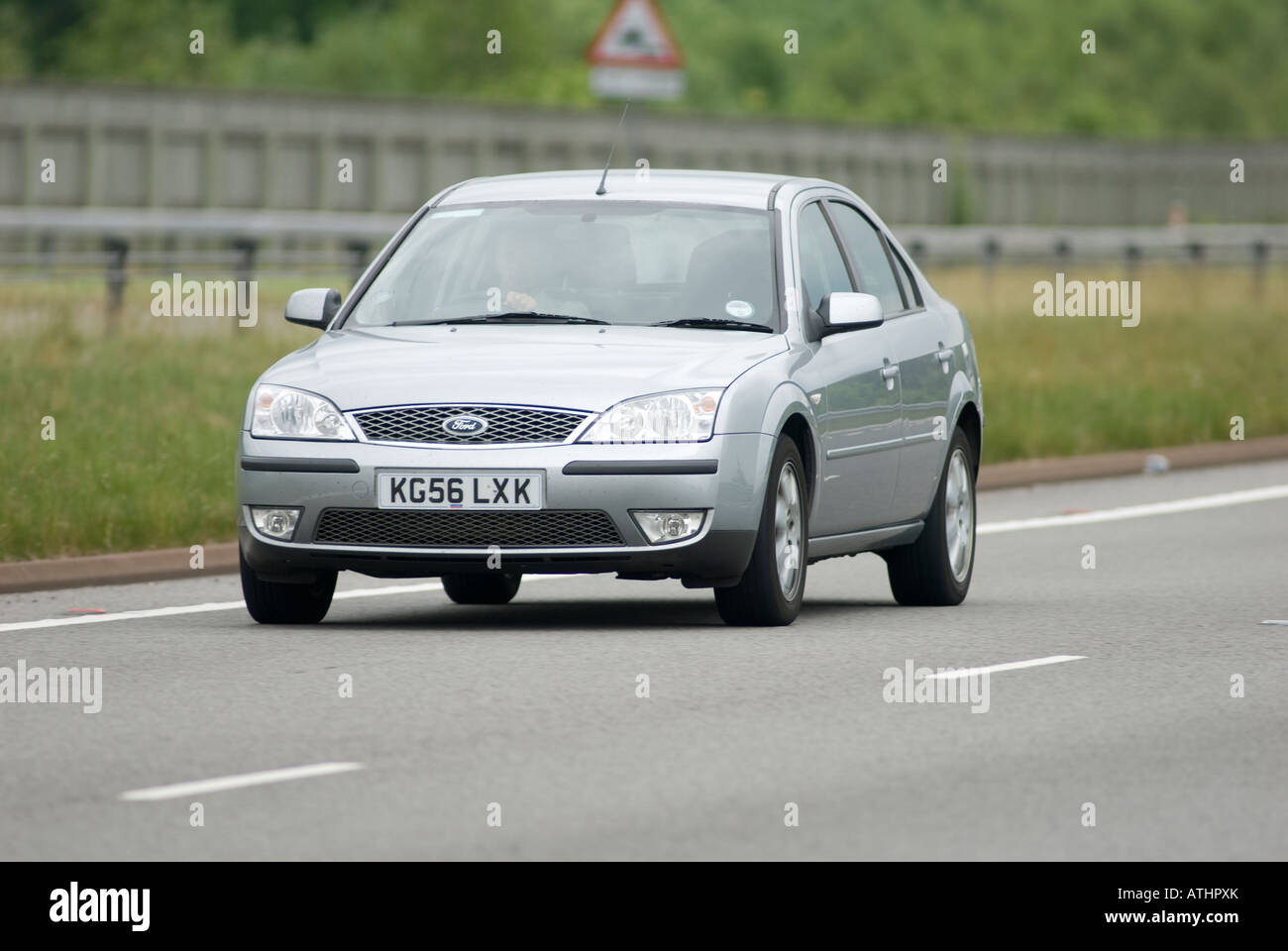 Silver ford car travelling on a british dual carriageway Stock Photo