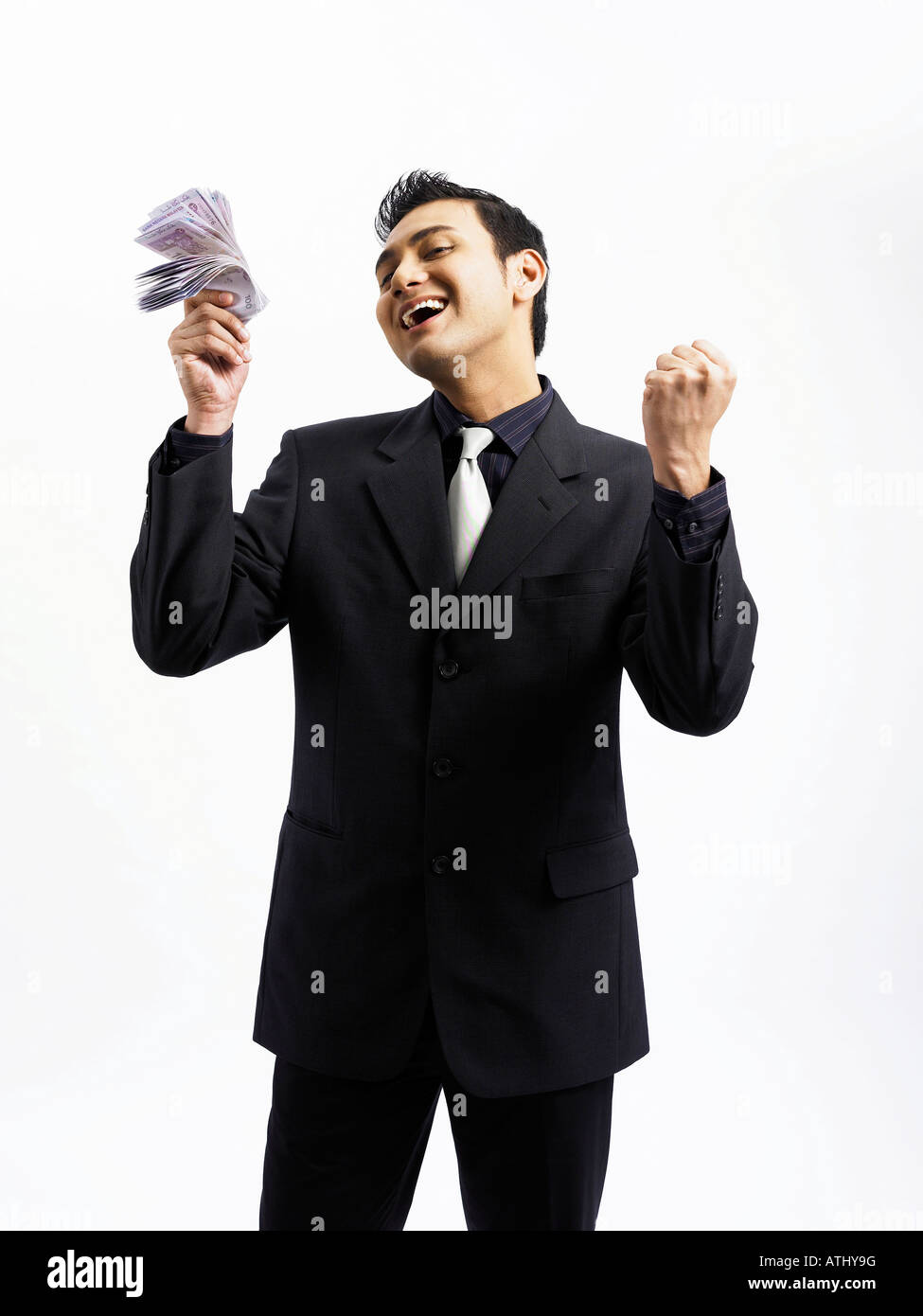 businessman happy with a stack of money in his hand Stock Photo - Alamy