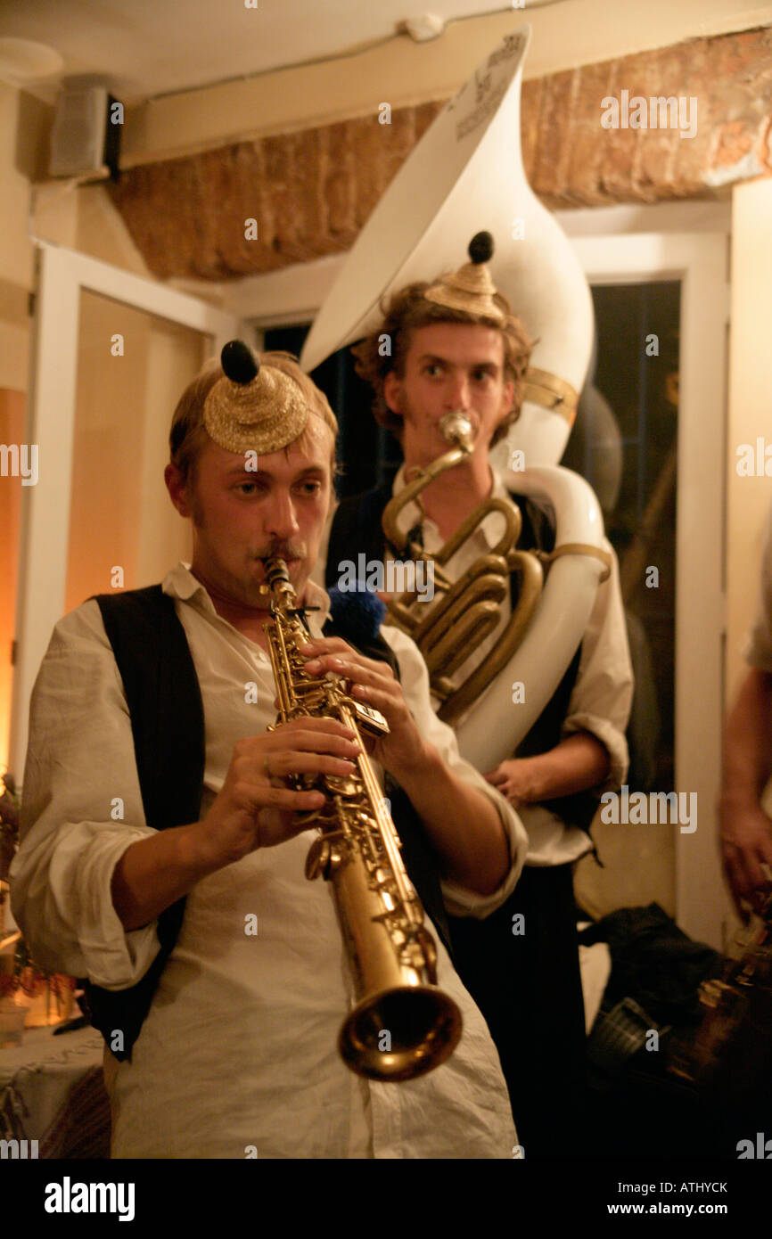 Members of the French group Brass Band Without Borders playing the oboe and sousaphone at a cafe in Istanbul, Turkey Stock Photo
