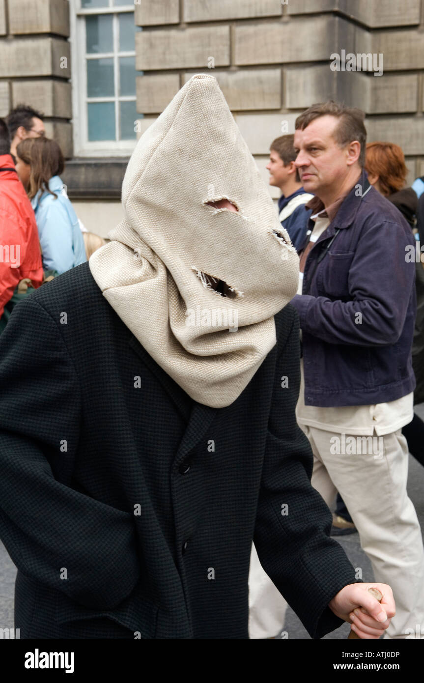 The Edinburgh Festival Fringe. Street performer walks the High Street of Edinburgh Old Town with a bag over his head. Scotland Stock Photo