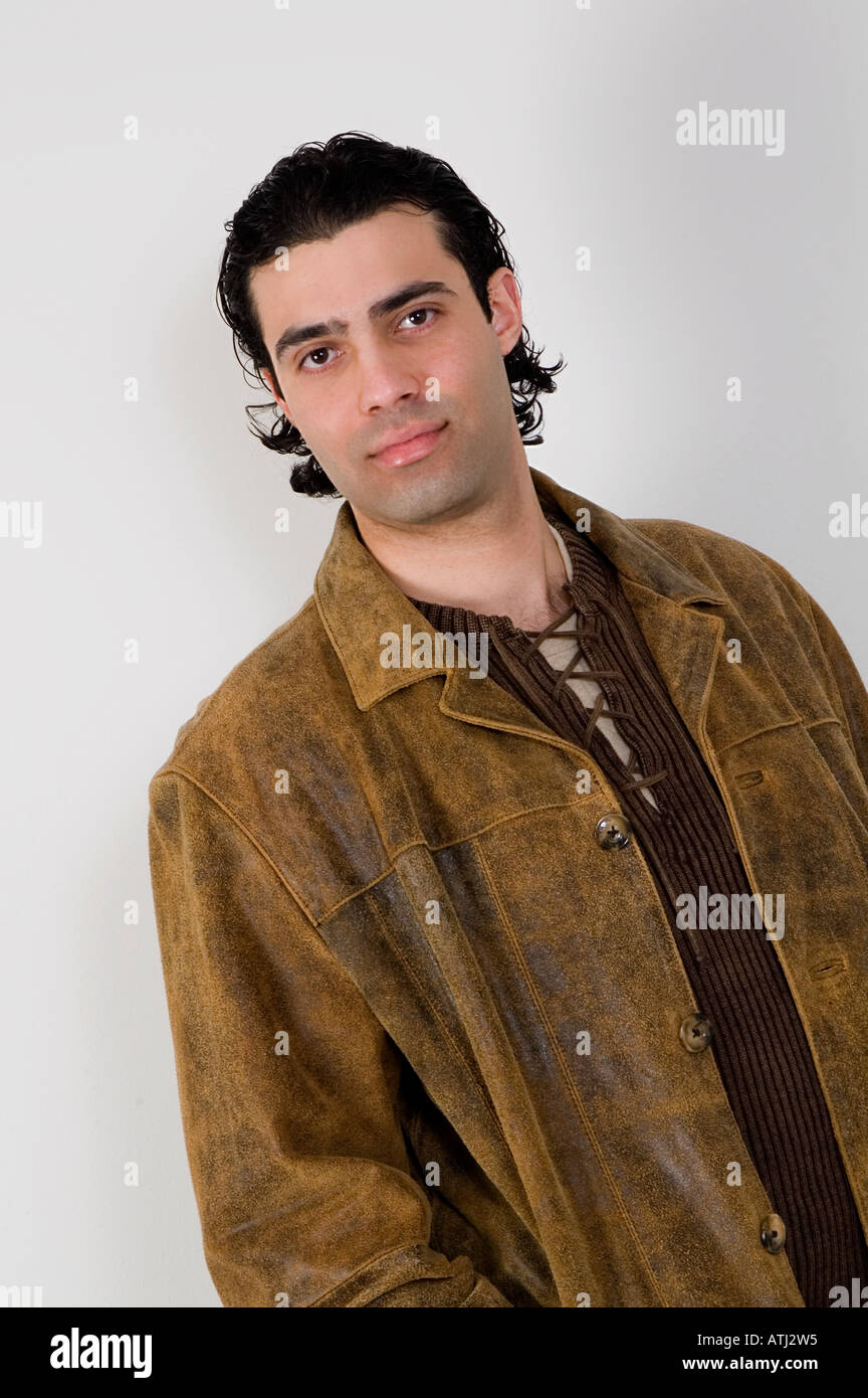 Handsome Egyptian man wearing brown jacket smiling Stock Photo - Alamy