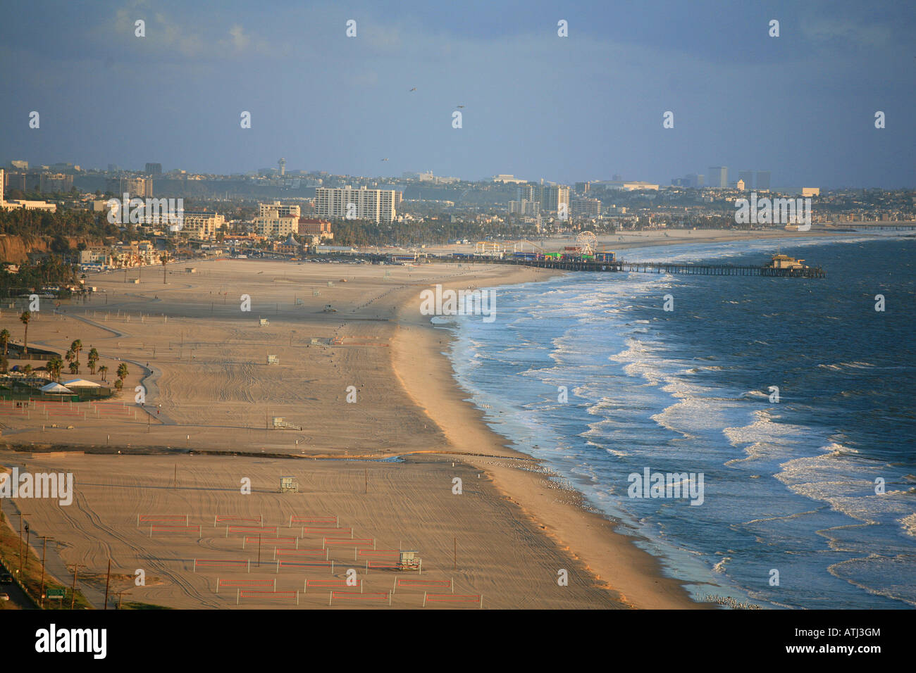 Aerial view of Santa Monica Pier and beach in late afternoon light ...