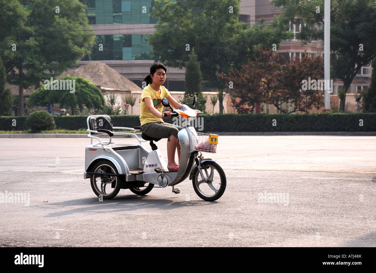 Woman on a tricycle rickshaw Shangqiu City Henan Province China Asia Stock Photo