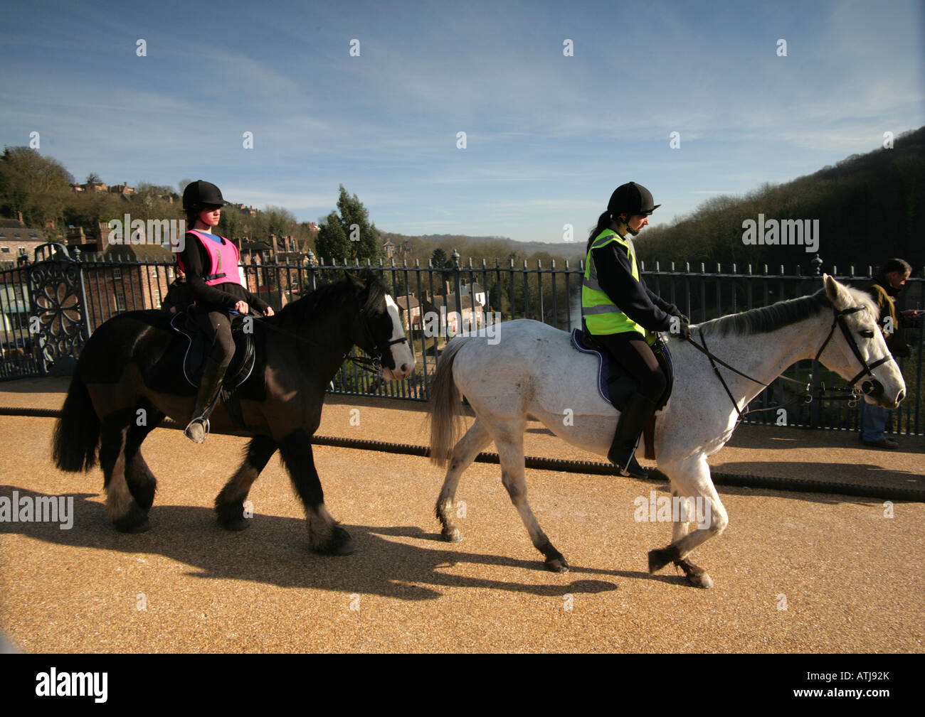 Horse riders  historic landmark  Ironbridge animals sunlight valley livestock journey motion free healthy Stock Photo