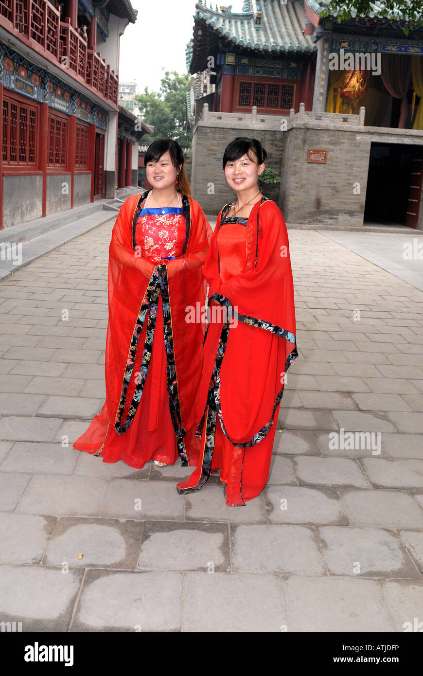 Two girls acting as guides at Chenghuang Temple Zhengzhou Henan Province China Ming Dynasty Asia Town God s Temple of Zhengzhou Stock Photo