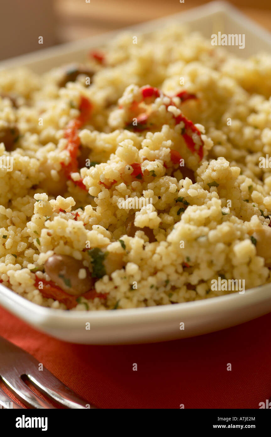Cous Cous with roasted pepper borlotti beans chickpeas and parsley Stock Photo
