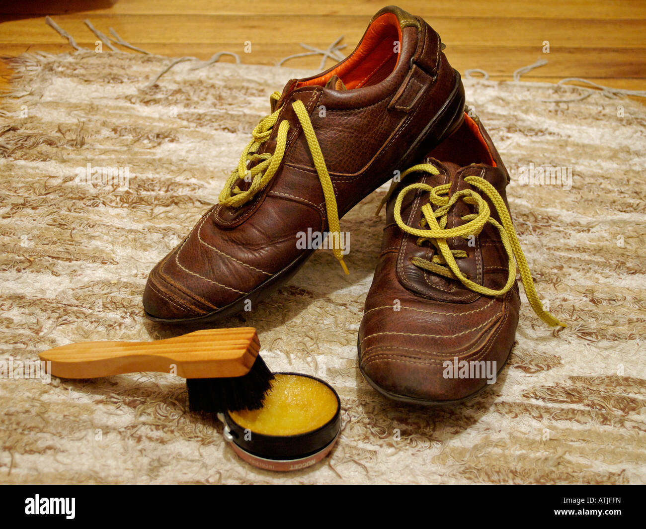 old brown skin shoes with yellow cords Stock Photo