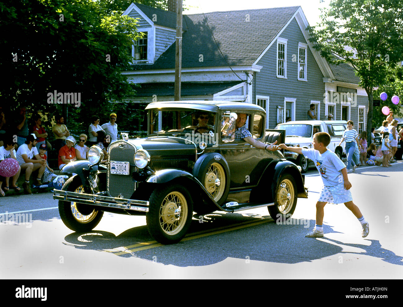 Antique car in July 4th parade in US town Stock Photo - Alamy