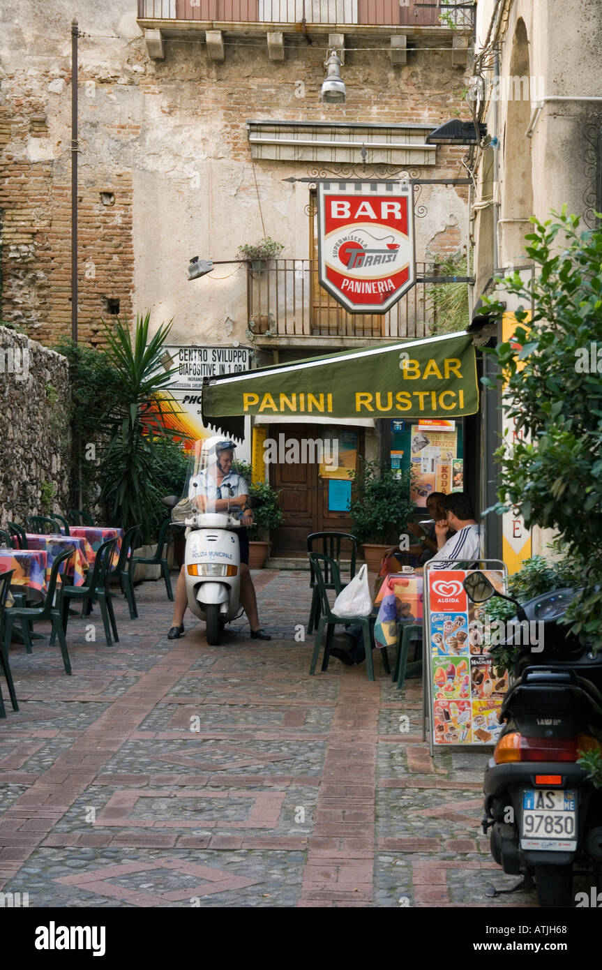 A little bar down a laneway off the Corso Umberto 1, the main shopping street in the popular resort town of Taormina, Sicily, It Stock Photo