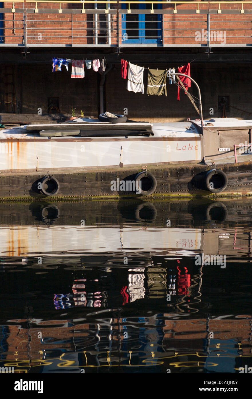 Washing on Canal Boat Reflected in the Water, Leeds, Yorkshire, England, UK Stock Photo