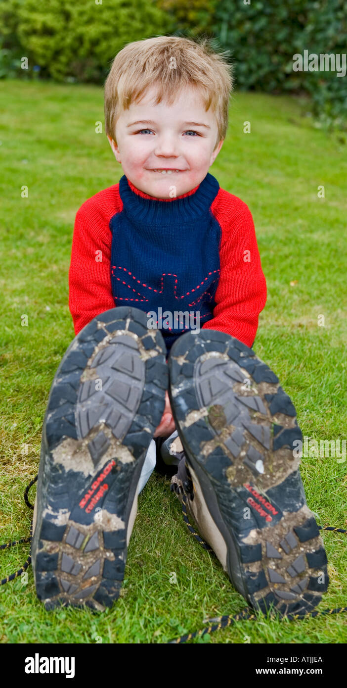 Boy wearing boots hires stock photography and images Alamy